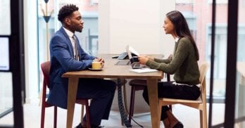 A professional being taken through interview coaching